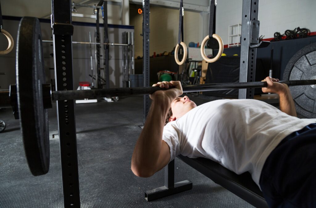 Man performing bench press exercise