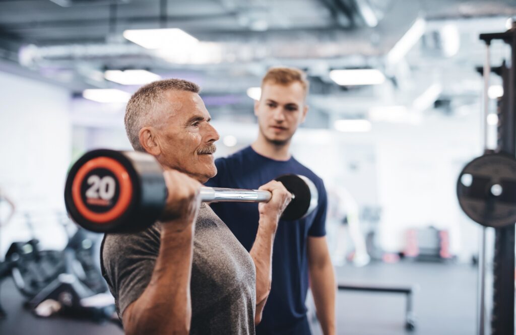 Gym workout with personal trainer