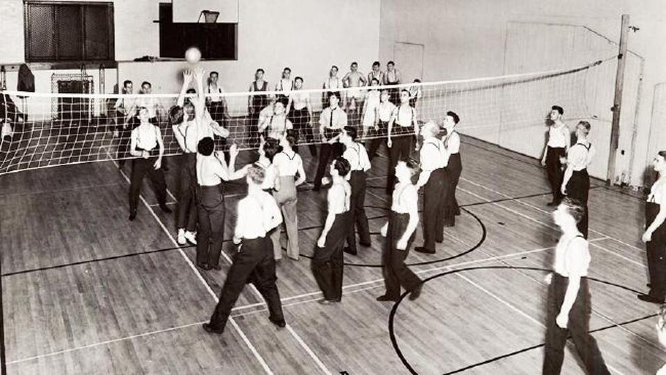 Early 1900s image of gymnasium volleyball